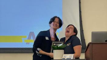 Alyssa Parsons receives the Outstanding GPC Award from Nicole Rabaud